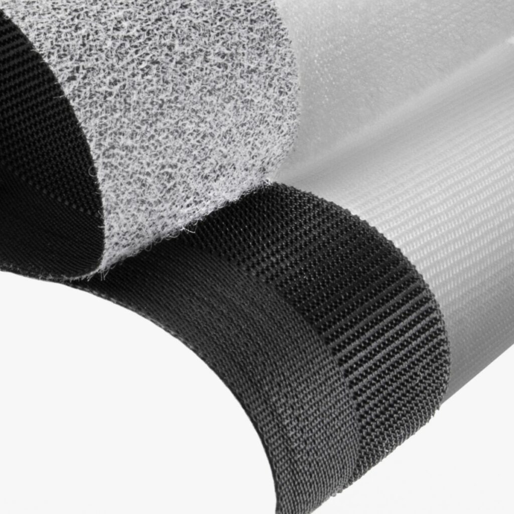 Low profile hook and loop for personal care and transportation